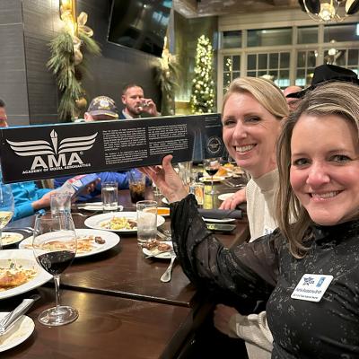 AFA Teachers hold model airplane.