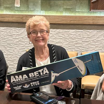 CAP personnel hold model airplane