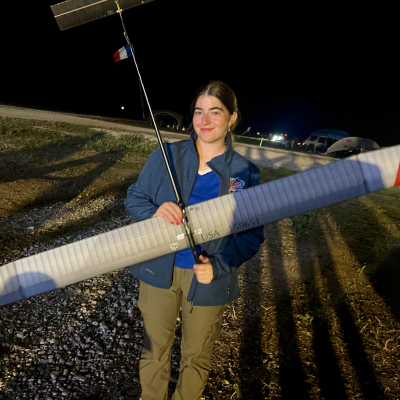 Anat Goldstein with model aircraft posing for the camera