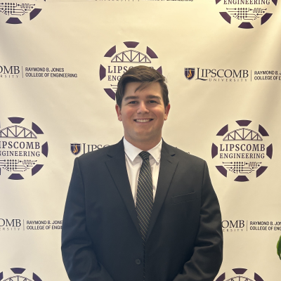 Luke Hohman a man wearing a suit and tie