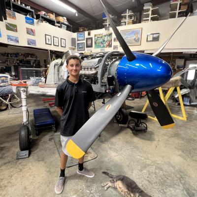 Jonah Paulino a person standing next to a plane