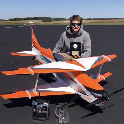 Greyson Pritchett with model aircraft posing for the camera