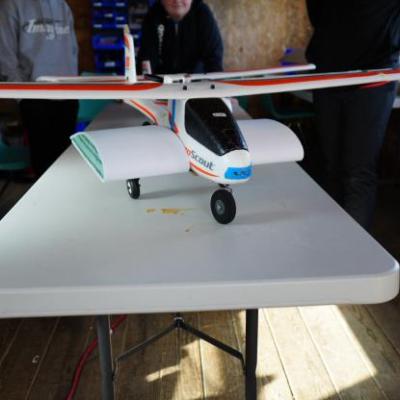 a airplane that is sitting on a table showcasing the water drop mechanism 