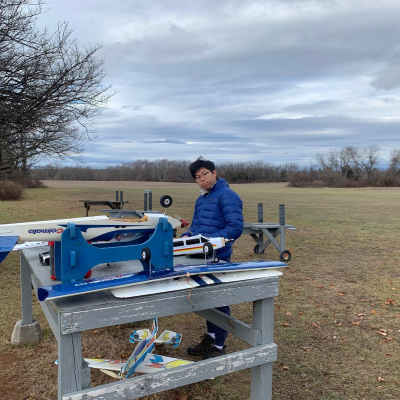 A young man working on a model plane