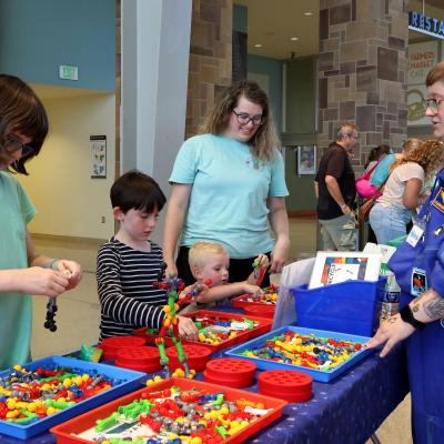 Family at Challenge Booth Tinkerfest
