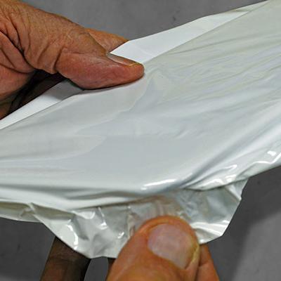 a hand holding a piece of paper