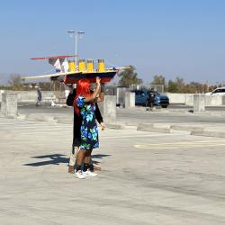 a person standing in a parking lot