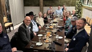 a group of people sitting at a table