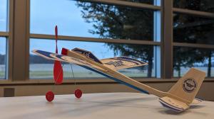 balsa glider sitting on a table