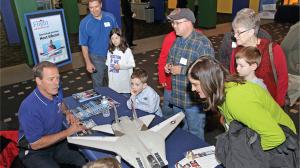 AMA Ambassador and NASA Astronaut Hoot Gibson shares his story with attendees of the CSI: Flight Adventures exhibit opening. 
