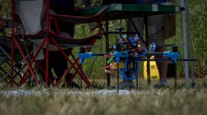 drone sitting in the grass, ready to fly soon