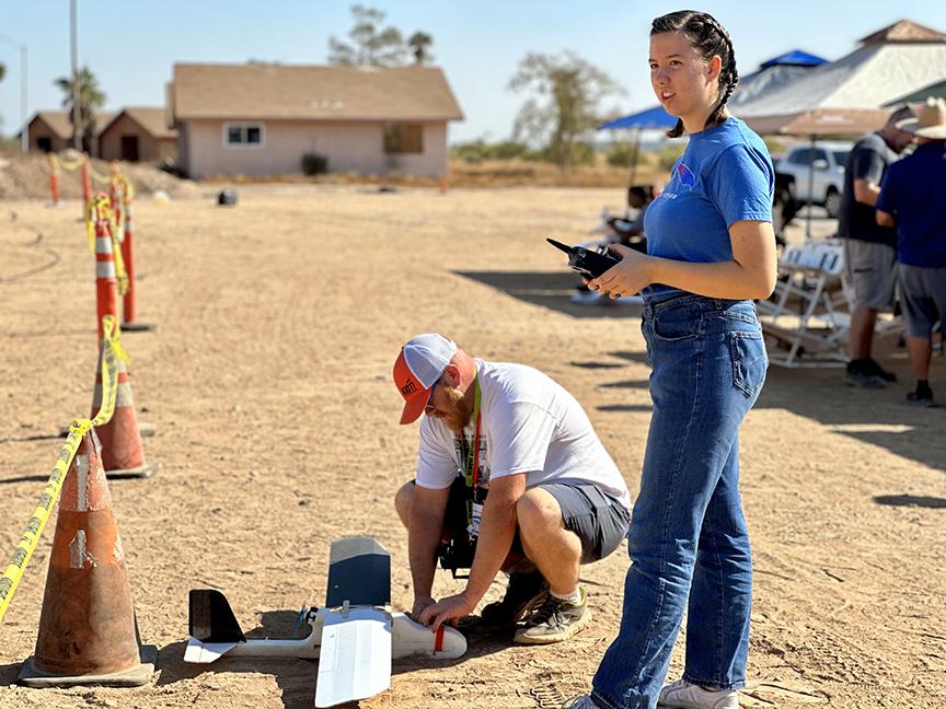 a person flying a model plane