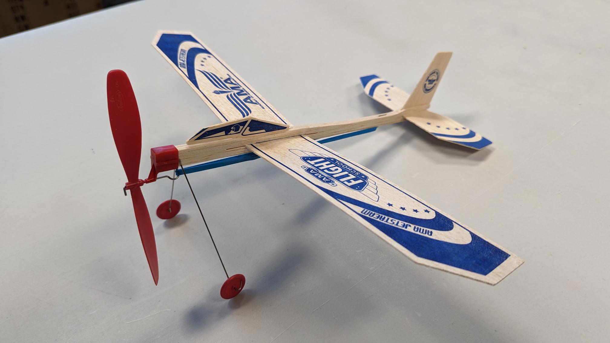 a close up of a balsa glider
