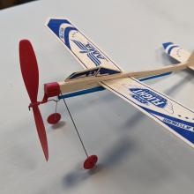 a close up of a balsa glider