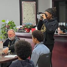 a group of people sitting at a table