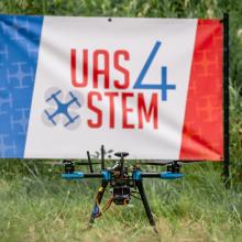 a drone in front of a UAS4STEM sign