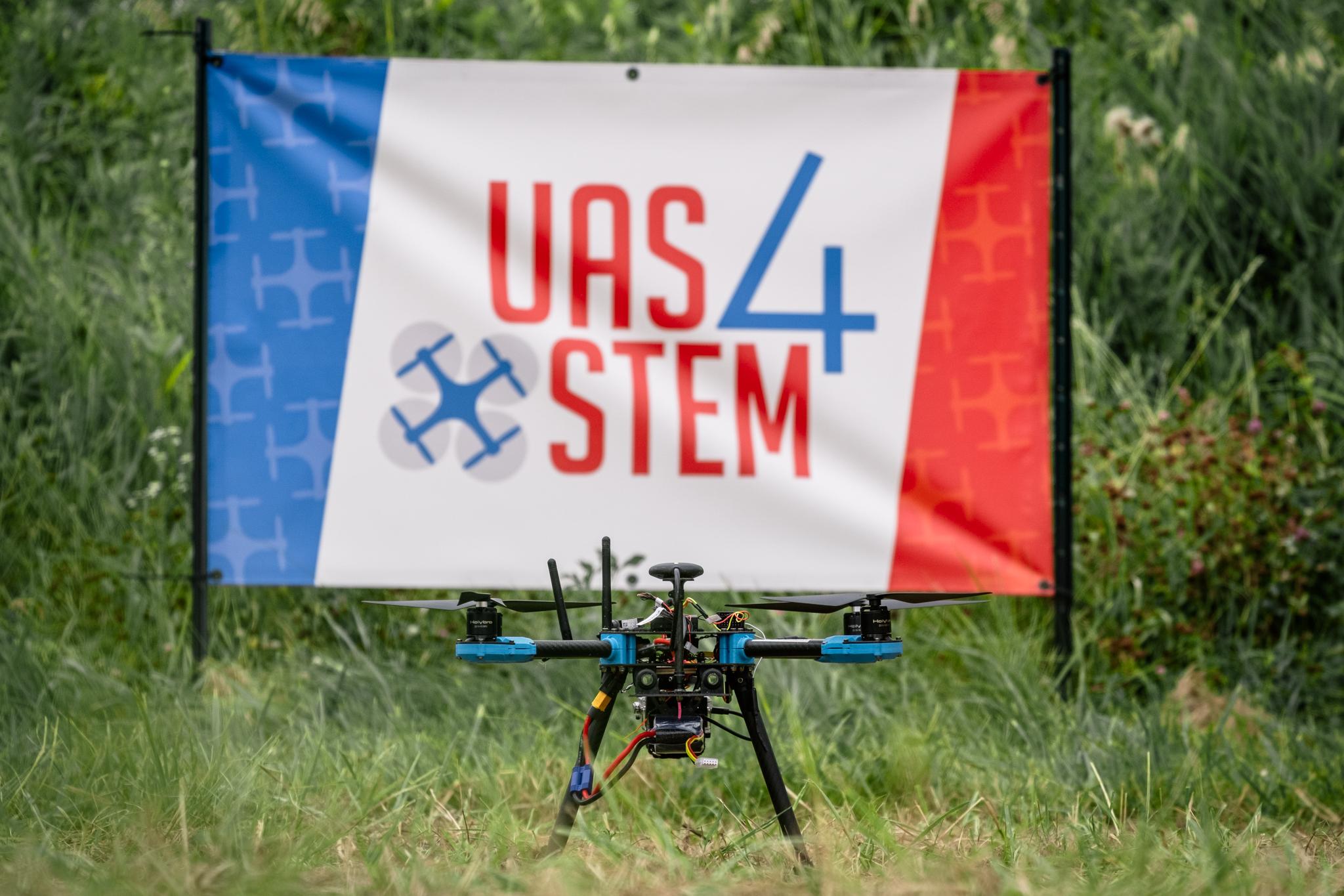 a drone in front of a UAS4STEM sign